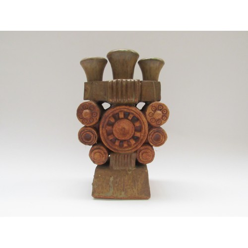 9100 - BERNARD ROOKE (b.1938) A studio pottery brutalist form candle holder. 26cm high