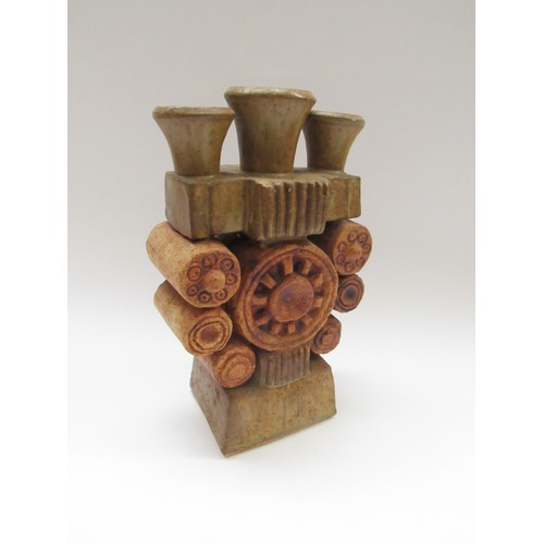 9100 - BERNARD ROOKE (b.1938) A studio pottery brutalist form candle holder. 26cm high