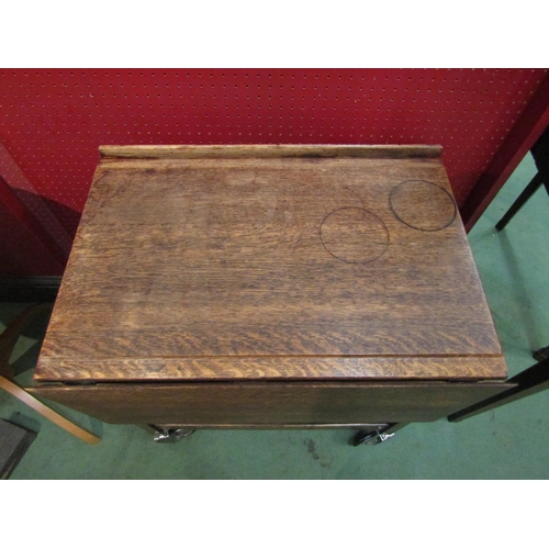 4170 - A circa 1950/60 Fyne Ladye of Banbury oak tea trolley with end drawer, the rising leaves over wheels... 