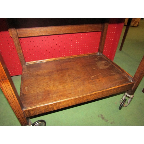 4170 - A circa 1950/60 Fyne Ladye of Banbury oak tea trolley with end drawer, the rising leaves over wheels... 