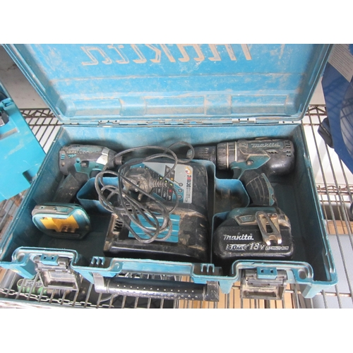 3317 - A cased cordless Makita drill and a wrench with charger and battery