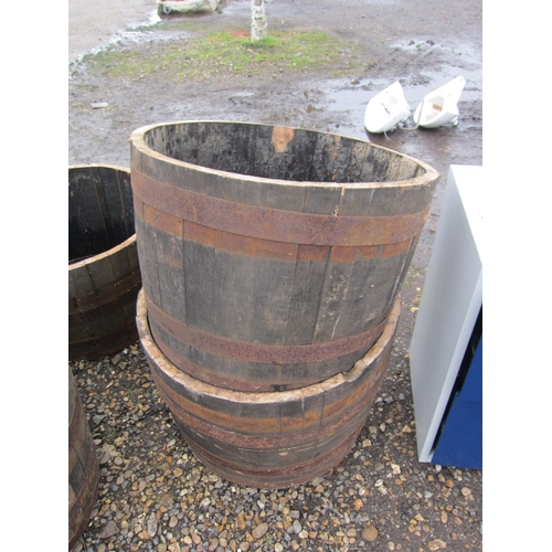 3523 - A pair of half barrel planters