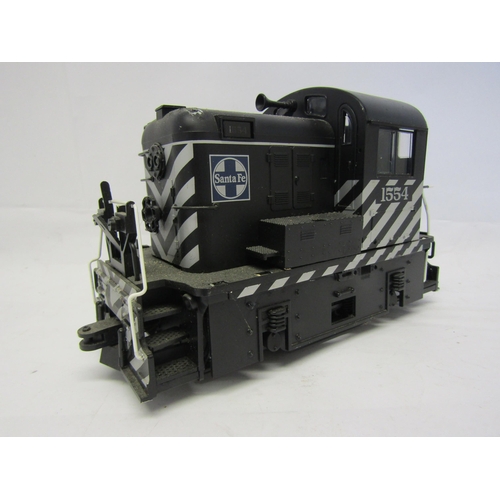 8586 - A G scale 0-4-0 diesel shunting locomotive, finished as no. 1554 in black Santa Fe livery, probably ... 