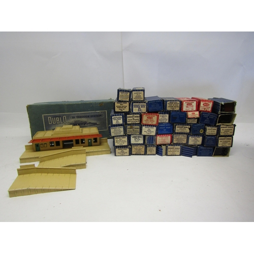 8499 - A boxed Hornby Dublo 00 gauge D1 Through Station and forty-two boxed goods wagons and passenger coac... 