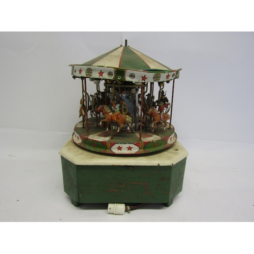 8366 - A scratch built model of a fairground carousel, the painted metal carousel with mounted cowboy and N... 