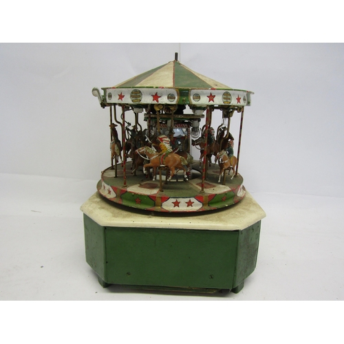 8366 - A scratch built model of a fairground carousel, the painted metal carousel with mounted cowboy and N... 