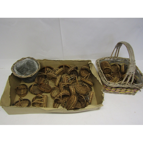 8306 - A collection of miniature wicker baskets