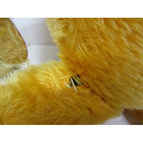 8304 - A straw filled golden mohair teddy bear with glass eyes, stitched nose and mouth and articulated lim... 