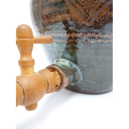 9037 - An Abuja Pottery stoneware flagon with screw top in the Michael Cardew tradition, strap handle. Iron... 