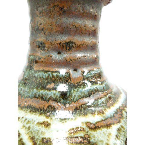 9037 - An Abuja Pottery stoneware flagon with screw top in the Michael Cardew tradition, strap handle. Iron... 