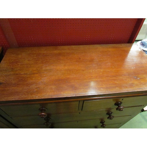 4064 - A late Victorian mahogany chest of two short over three graduating long drawers with turned handles ... 