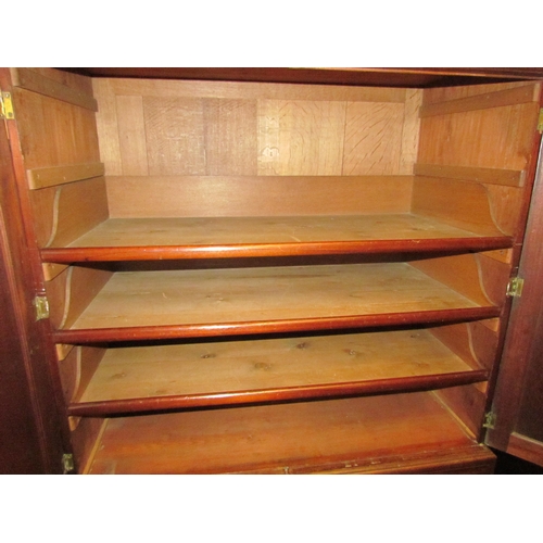 4131 - A Victorian mahogany linen press with oak lined drawers and shelves.  The lower section consists of ... 