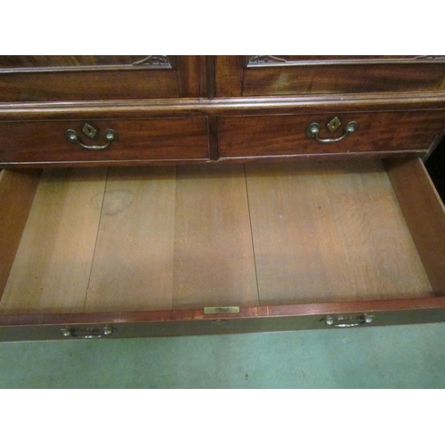 4131 - A Victorian mahogany linen press with oak lined drawers and shelves.  The lower section consists of ... 