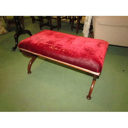 4174 - A mahogany x-frame stool with red velvet upholstery, 45cm tall x 82cm long x 46cm deep