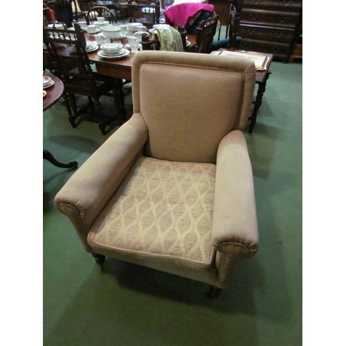 4176 - A late Victorian armchair, the scroll arms and feather filled cushion on ring turned tapering oak fo... 