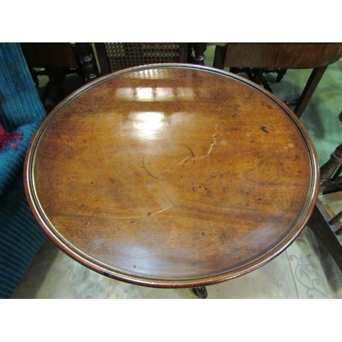 4186 - An early Victorian rosewood and mahogany circular dished top wine table on a tapering spiral/turned ... 