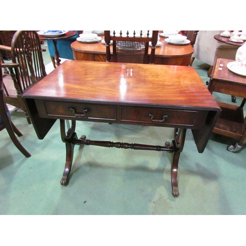 4191 - A George III style flame mahogany sofa table, the rising leaves over two frieze drawers on a lyre en... 