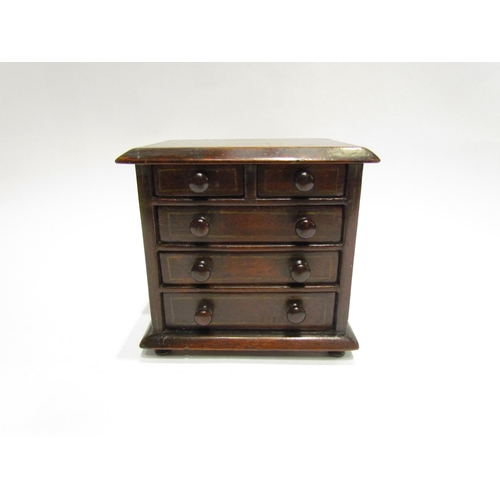 4514 - A Victorian miniature apprentice piece mahogany chest of drawers, 14.5cm tall