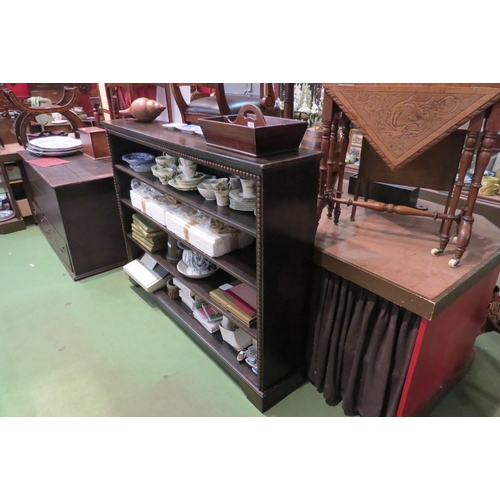 4216 - A Circa 1920 oak bookshelf in the Jacobean style with half bobbin turned moulded decoration on a bra... 