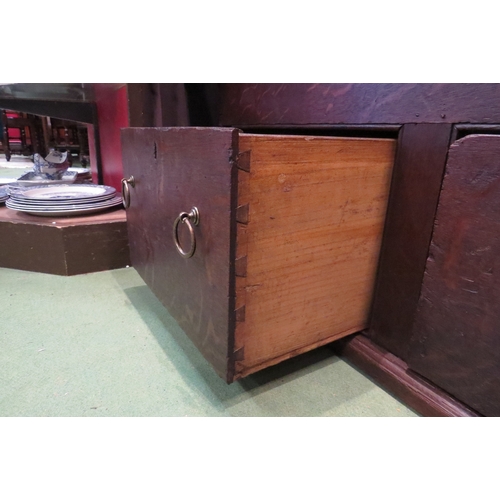 4219 - A George III red oak mule chest with exposed dovetail decoration, the three plank cleated end hinged... 