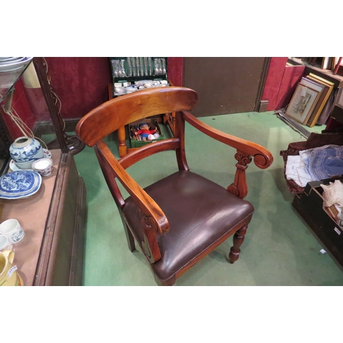 4236 - A Victorian style walnut desk armchair with scroll arms over turned and tapering fore legs   (R) £40