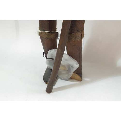 4238 - An articulated African wooden figure, a/f