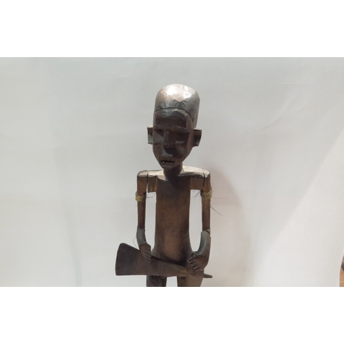 4238 - An articulated African wooden figure, a/f