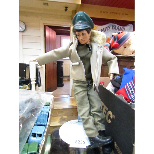 8255 - A vintage Eagle Eyes Action Man figure with brown flock hair, with green jumper and trousers, black ... 