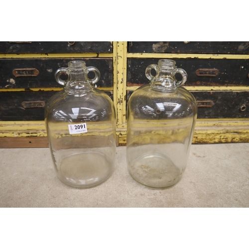 2091 - A Pair Of Glass Demijohns   (R) £10