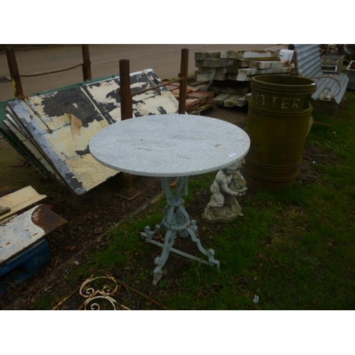 5035 - A cast iron based, round marble top table, 28