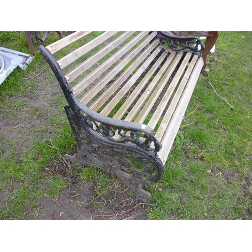 5089 - A decorative cast iron ended garden bench with horse and peacock design, stamped MV, 52