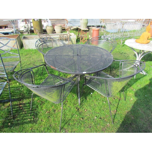 5108 - A circular lattice work garden table and four armchairs, 41.5