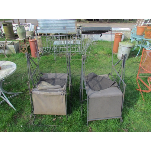 5111 - A pair of vintage wrought iron swinging garden chair frames for re-canvasing