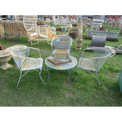 5119 - A metal and mesh garden set of three chairs and low table