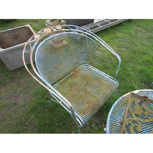 5119 - A metal and mesh garden set of three chairs and low table