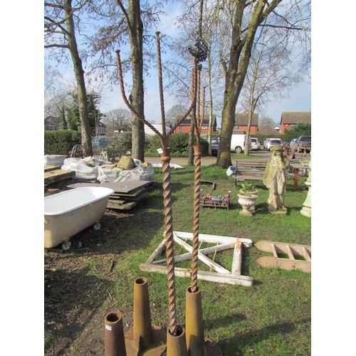 5169 - A pair of decorative twisted iron poles, approx 77