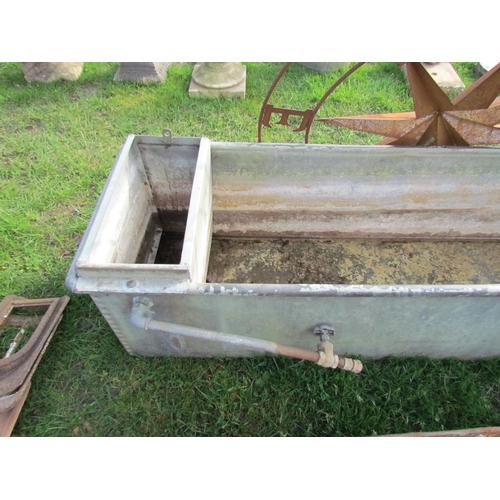 5191 - A riveted galvanised water trough, 73.5