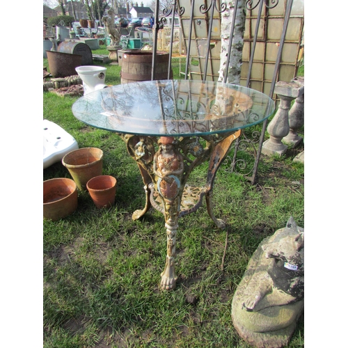 5204 - A cast iron pub table base with round glass top  (R)  £50