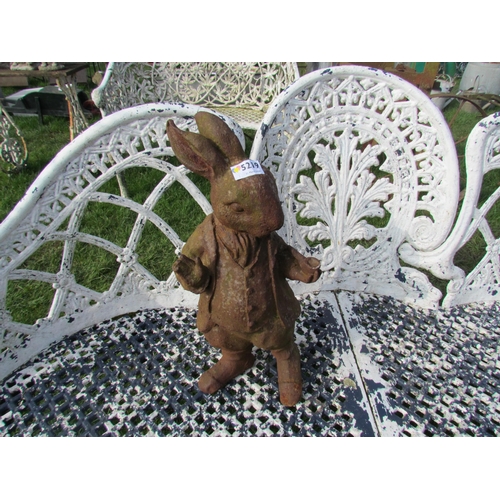 5219 - A cast iron standing rabbit with pipe, 16