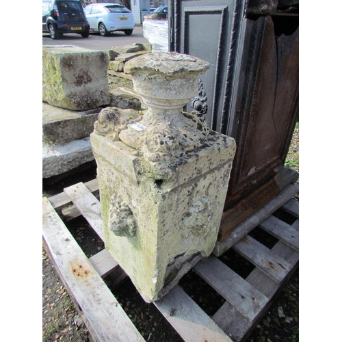 5236 - A weathered stone plinth depicting mythical fish heads, 27