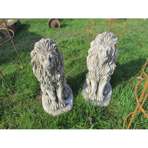 5252 - A small pair of seated composition lions, 15