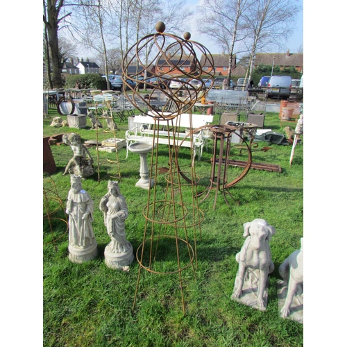 5257 - A pair of decorative steel orb obelisks