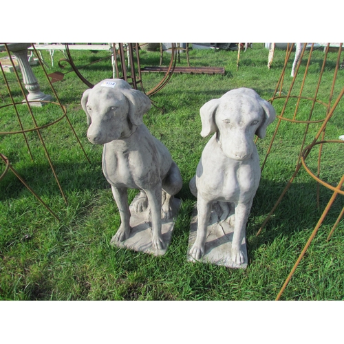 5258 - A pair of composition seated hounds, 27