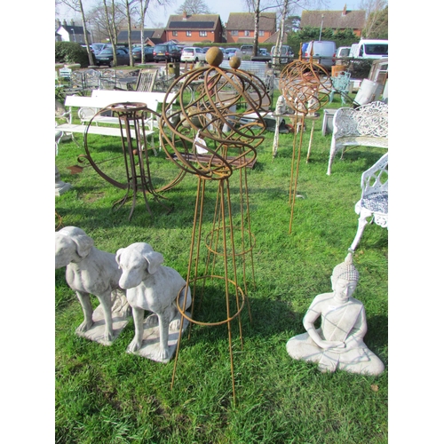 5259 - A pair of steel decorative orb obelisks