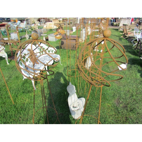 5259 - A pair of steel decorative orb obelisks