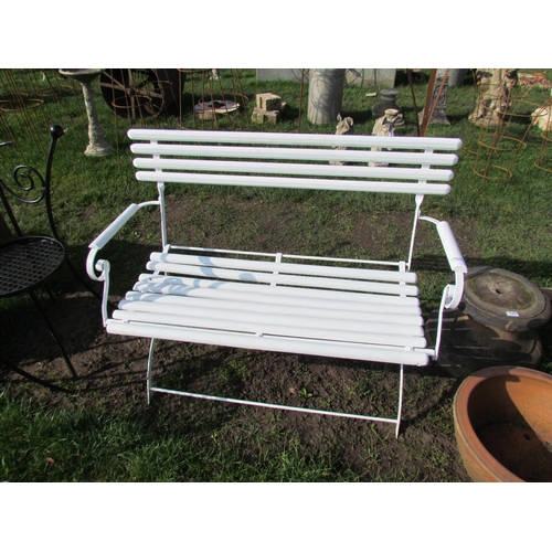 5291 - A folding wood and metal garden bench, 43.5