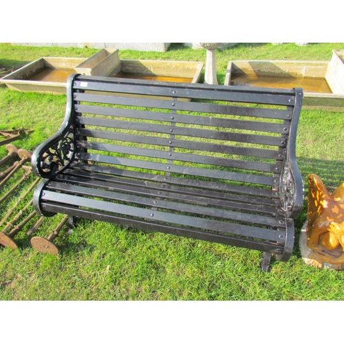 5325 - A decorative iron ended garden bench, floral ends, wooden slats, 49