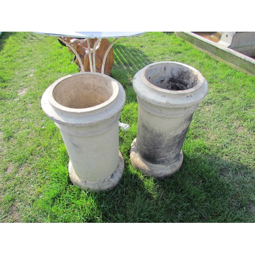 5329 - A pair of buff cannon top chimney pots