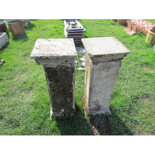 5338 - A pair of weathered composition plinths in three sections, 30