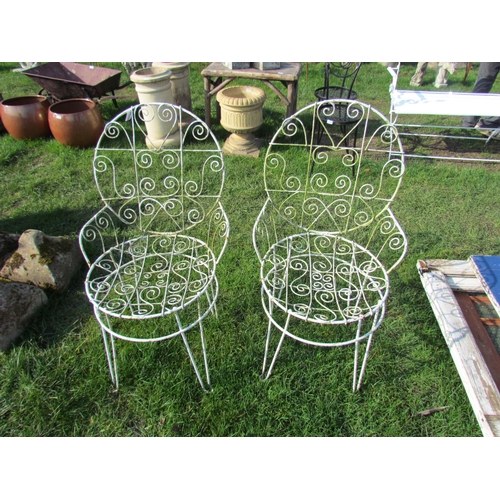 5340 - A pair of white wirework garden chairs